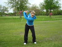Caitlin golfing